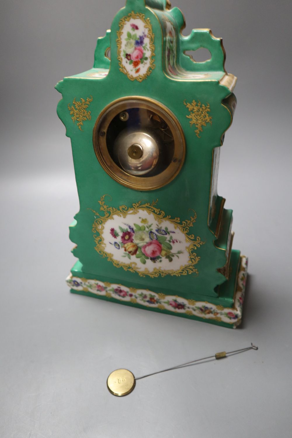 A 19th century French porcelain mantel clock, 33cm